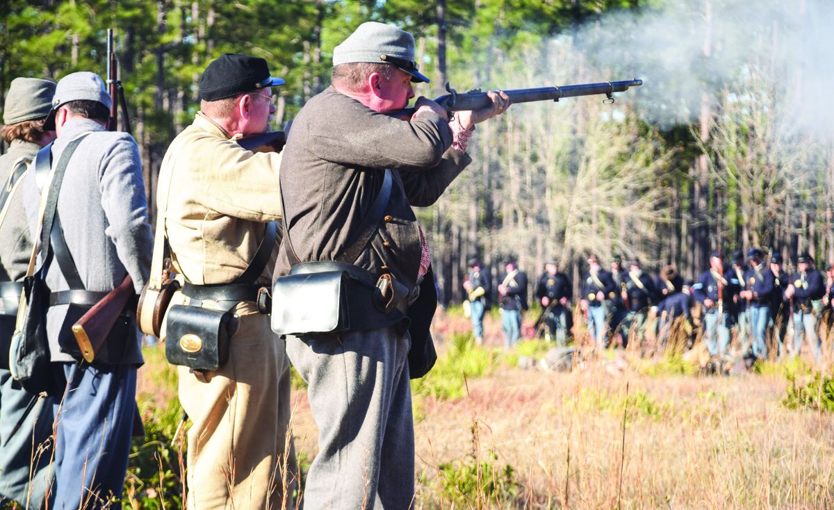 Confederates infantry fire back while standing like a stone wall during the Union onslaught.