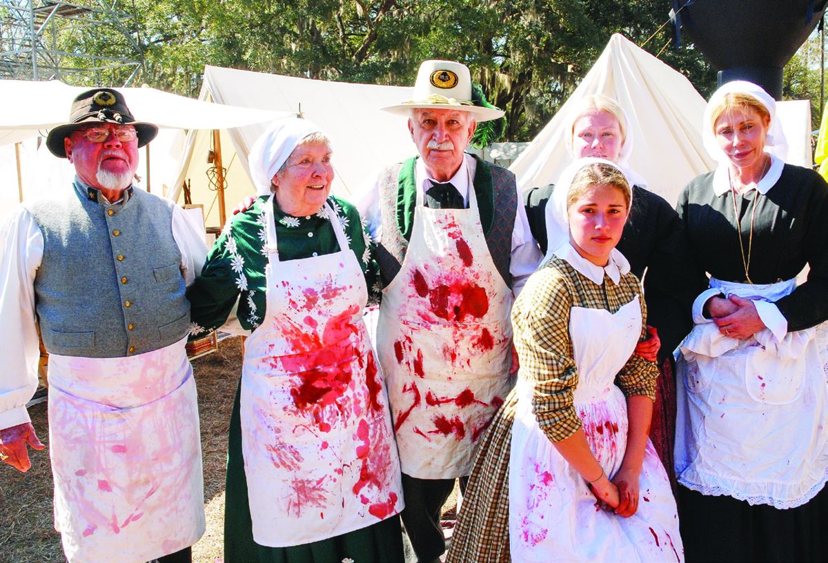 Leonard “Doc Woody” Woodrum, center, and his team of medical interpreters offered event patrons a realistic look at surgical procedures in the field as they were done during the Civil War.