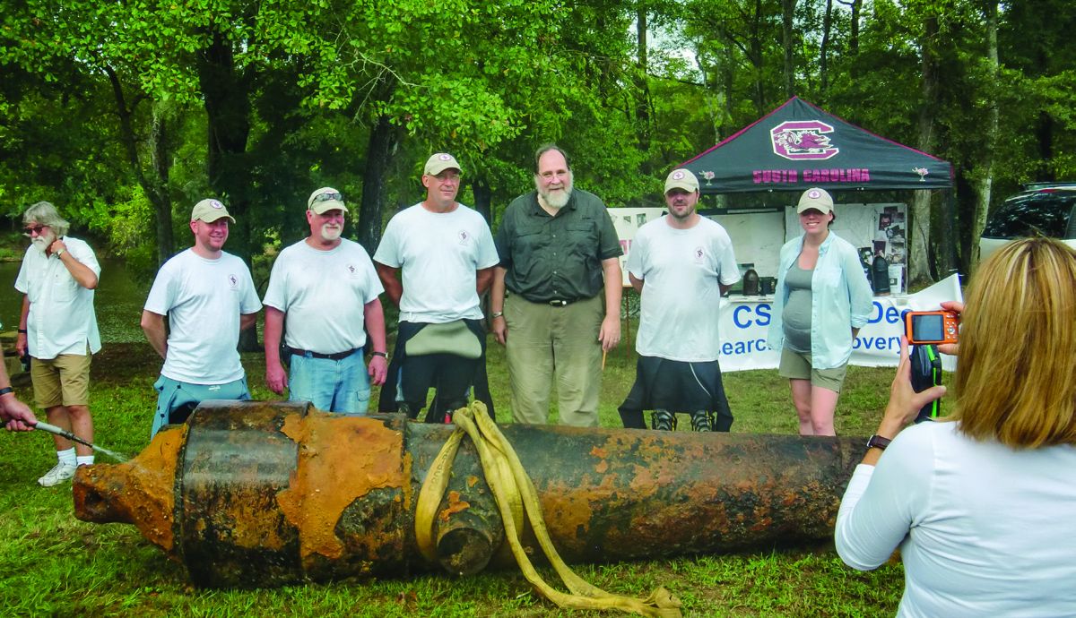 Standing behind the 7-inch Brooke rifle are Nate Fulmer, Joe Beaty, Dr. James Spirek, Dr. John Leader- the SC State Archaeologist, Daniel Brown and Jessica Irwin who all helped with the recovery. (Bill Lockridge)