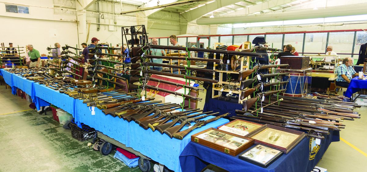 Vin Caponi’s large selection of antique weapons wrapped around the table block.