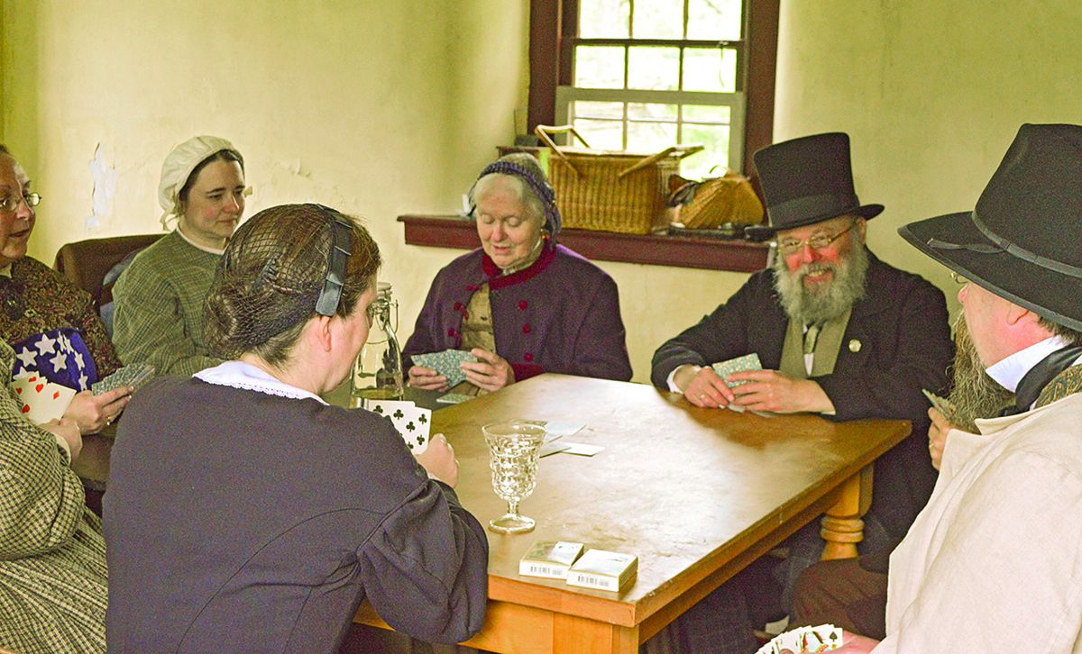 Brigitte Ross, Berlin, N.J., Megan Terry, Philadelphia, Pa., Faith Hintzen, Pine Hill, N.J., Mark Hintzen, Pine Hill, N.J., Brian Ross, Berlin, N.J., and Sherri Groff, Oaklyn, N.J., play a lively game of whist.