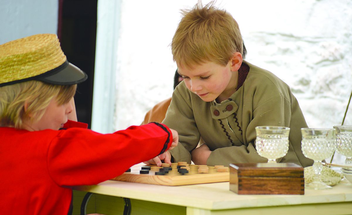 Eli Byrne, Rochester, N.Y. and Grayson Whitney, Buffalo, N.Y., enjoy a game of checkers.