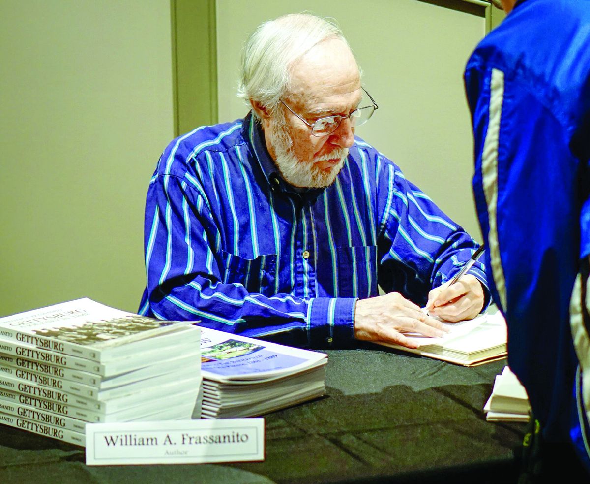 William A. Frassanito signs his books at an appearance at the Gettysburg Heritage Center during The Center for Civil War Photography’s 16th annual Image of War seminar. (Shenandoah Sanchez)