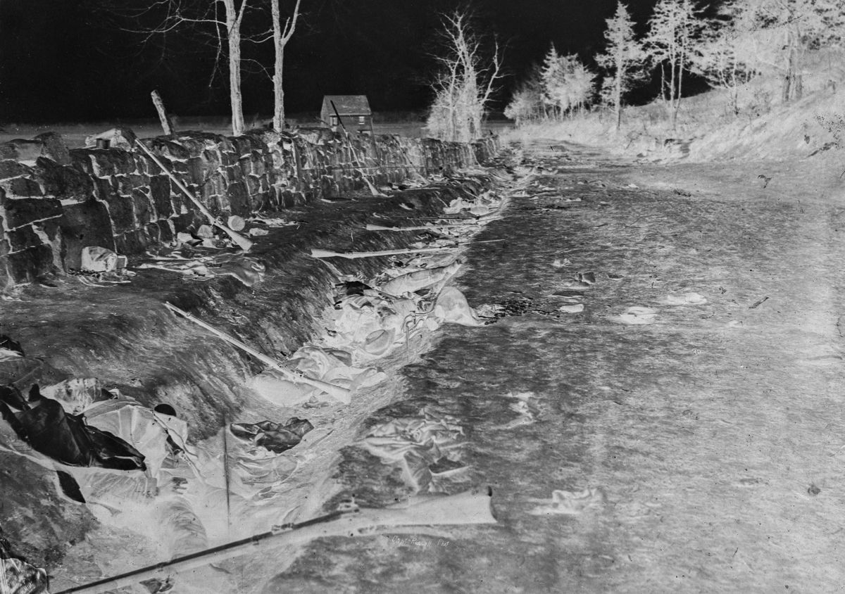 Stone wall at foot of Marye’s Heights, Fredericksburg, Va. at the front carried by 6th Maine Infantry, May 3, 1863. Photographed twenty minutes after storming party had [...] up the hill by Andrew J. Russell.