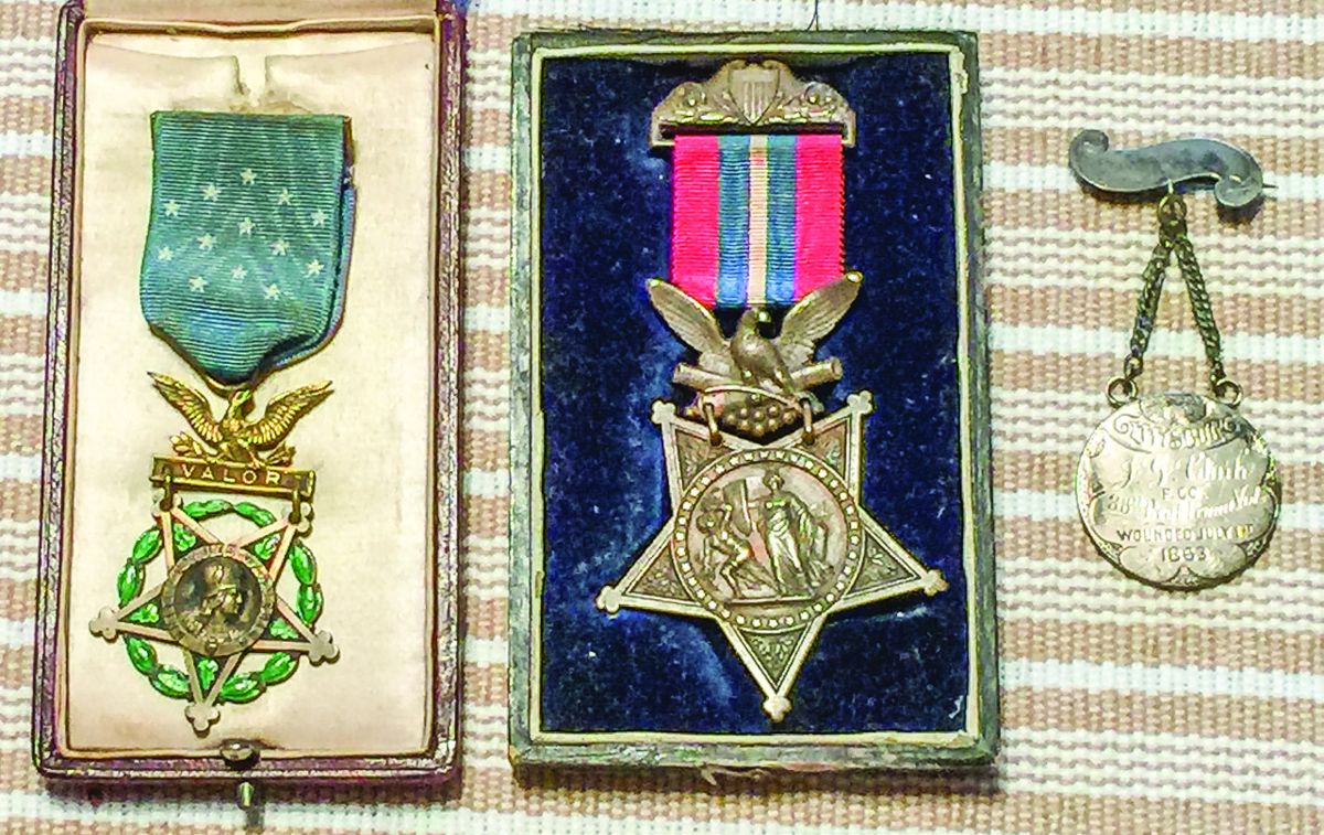 From left to right: 1903 issued MOH & 1892 MOH both in original boxes and unusual Gettysburg wound medal.