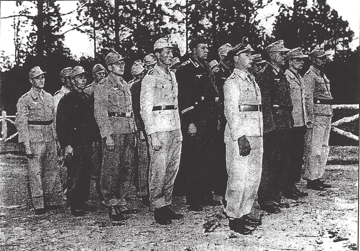 Newly arrived German POWS of the Afrika Korps wearing a variety of uniforms which were later replaced by PW clothing.