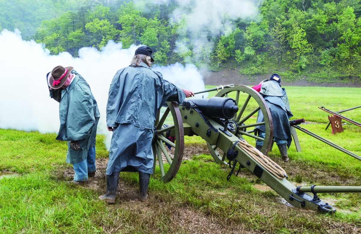 The gunner touches off his unit’s 10-pounder Parrott Rifle that fires a solid shot at the targets 200 yards down range.