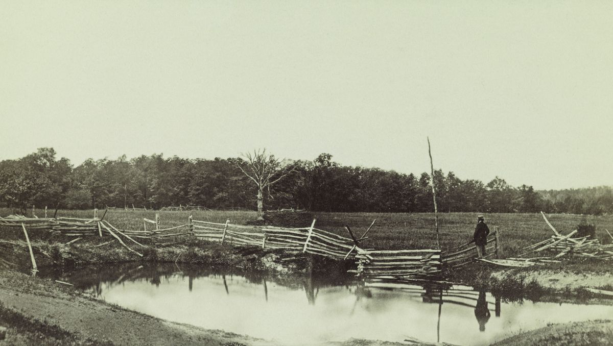 Near McPherson’s Farm, Mathew B. Brady gazes at part of the first day’s battlefield at Gettysburg in this albumen print that combines the scene captured in two different stereo negatives. (Library of Congress)