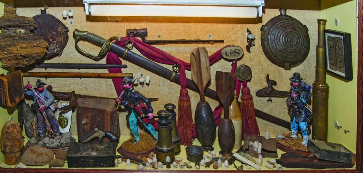 One of several encased displays in the attic of the Farnsworth House Inn. Note the two authentic Ketchum hand grenades center right. These grenades were invented by William F. Ketchum and patented on August 20, 1861.