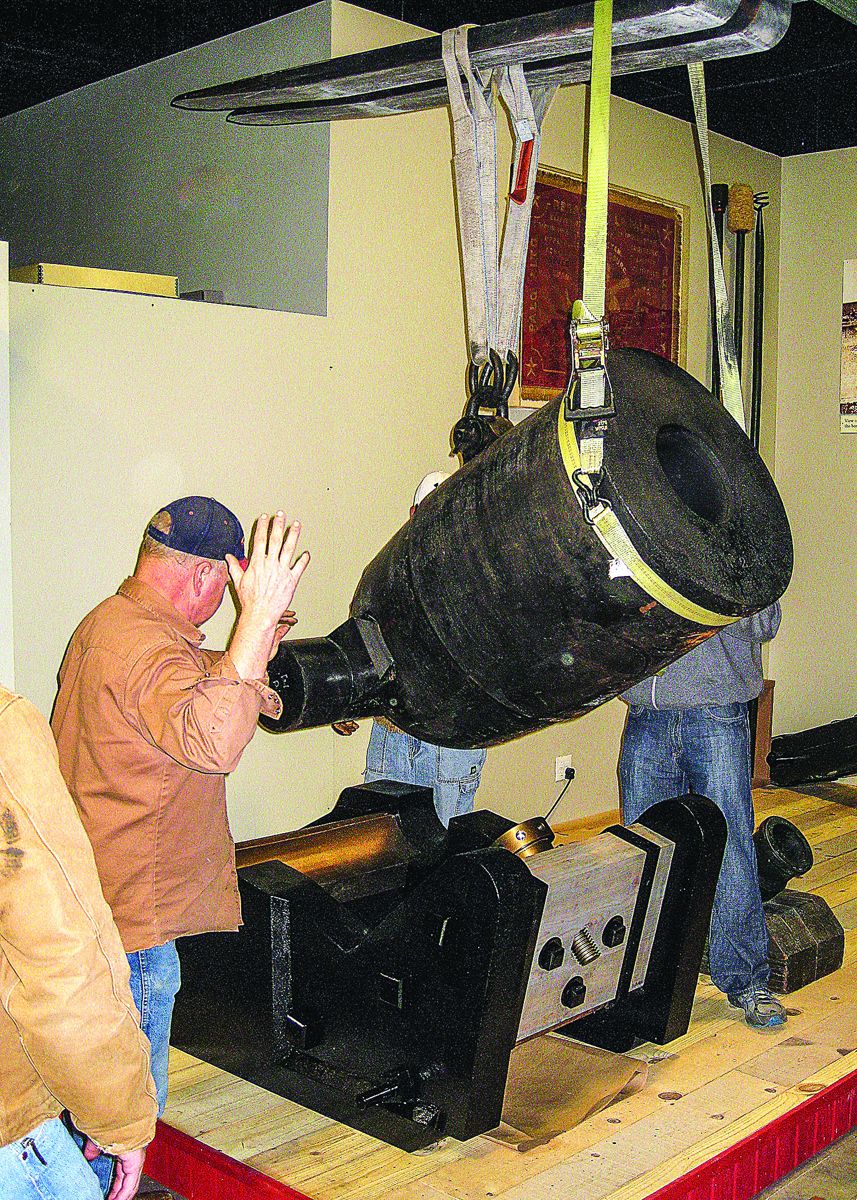 Museum volunteer, Harry Shappell, built the reproduction bed (carriage) with assistance from Exhibits Specialist, Zane Mohler, volunteer Michael Tomany and the LRC Metal Shop. They are installing the mortar in the museum’s display.