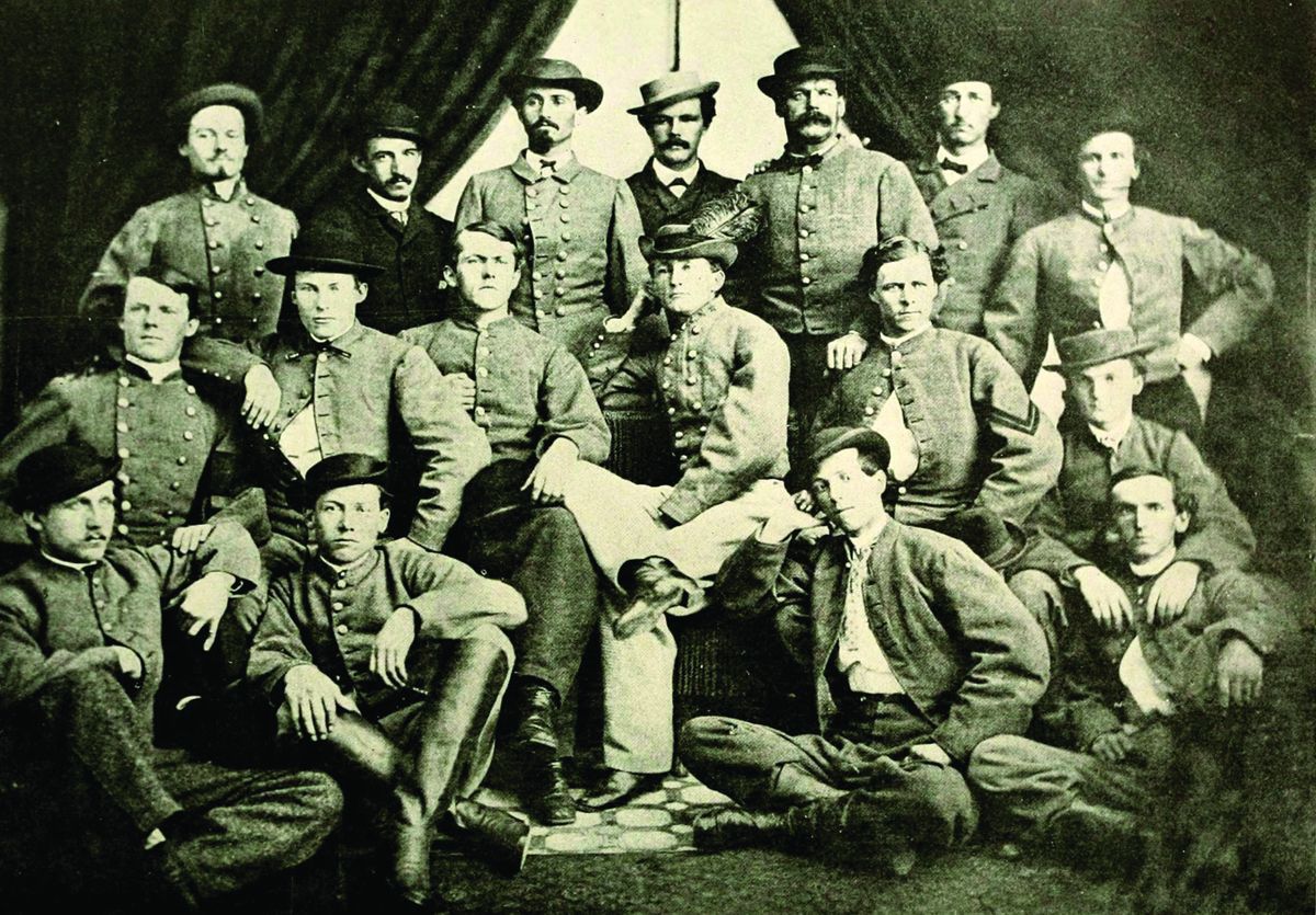 Mosby’s Rangers are, from left, front: Walter Gosden, Harry T. Sinnott, Otho L. Butler, Isaac A. Gentry; middle: Robert B. Parrott, Thomas Throop, John W. Munson, Col. John S. Mosby, [?] Newell, Charles H. Quarles; back: Lee Howison, W. Ben Palmer, John W. Puryear, Thomas Booker, A.G. Babcock, Norman V. (Naval History and Heritage Command)