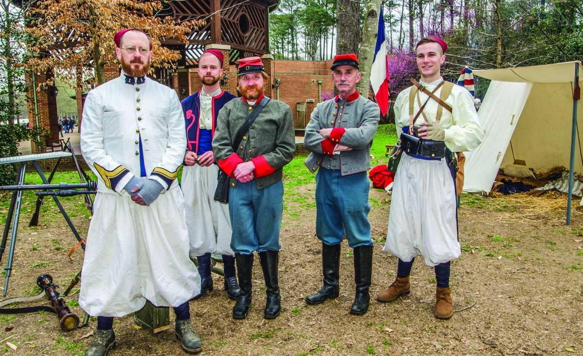 Sgt. Clint Brunt, far left, to his right is Mark Pettijohn and on the far right is Pvt. Matthew Tobin that are part of the 1907-1909 (First) Zouaves, (Third) Battalion-Machine Gun Section. Note similar uniforms to Civil War Zouaves. The two Confederate artillerists, Pvt. John Stansell and Pvt. Robert Fly are from the Norfolk Light Artillery Blues, 1861-1865.