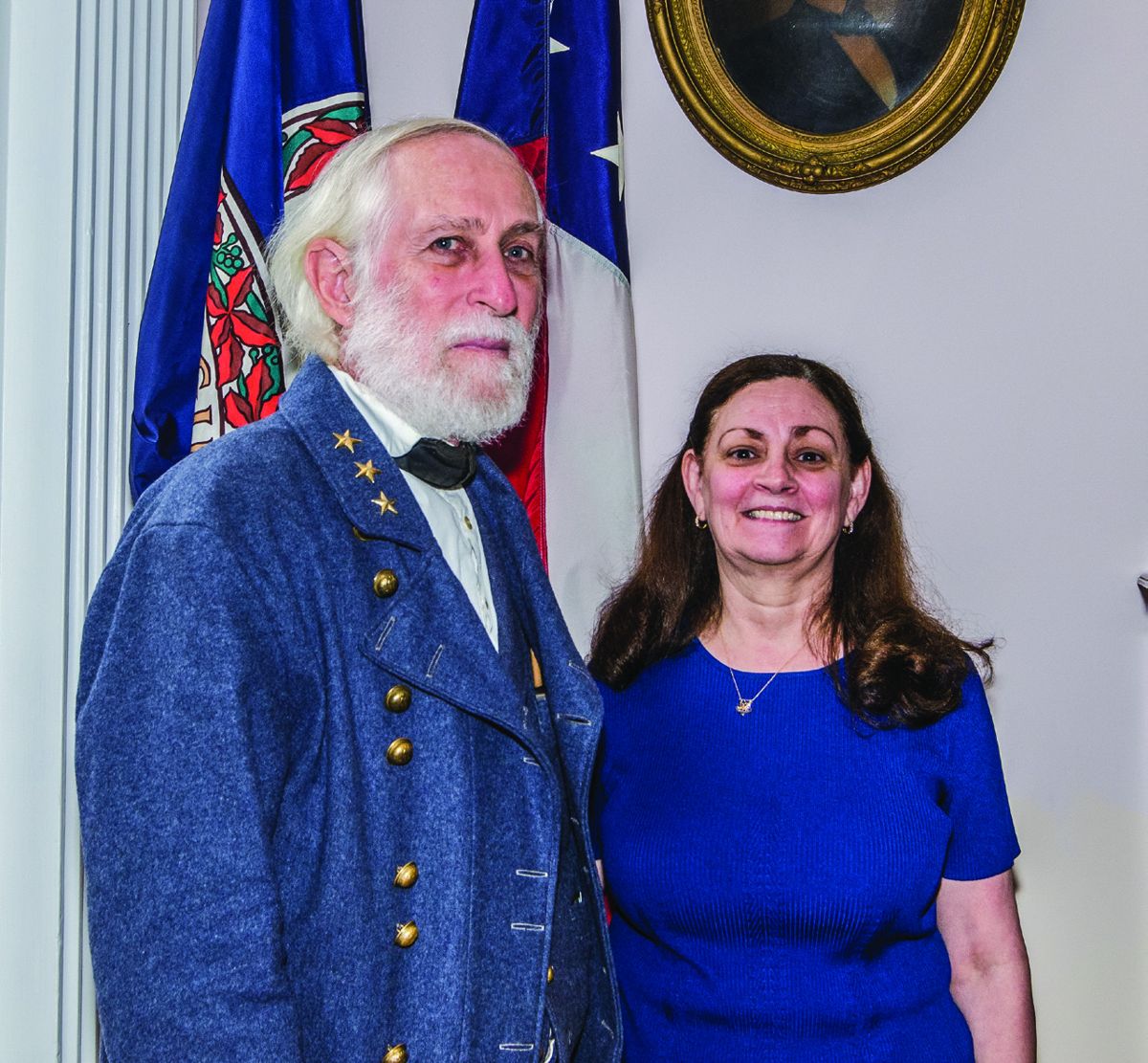 Al Stone and Debby Mullins, president of the Mary Custis Lee-17th Virginia Regiment Chapter 7, UDC pose for photographs during the event.