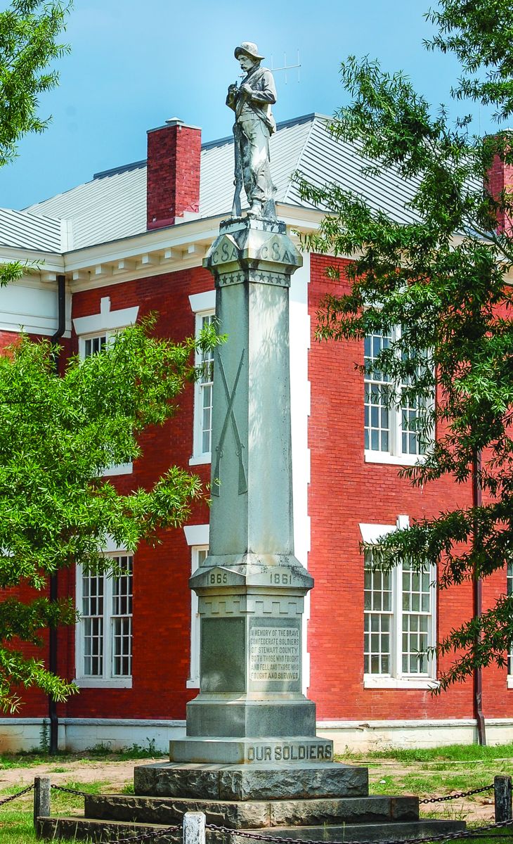 Stewart County, Lumpkin. Our soldier on the courthouse grounds in Lumpkin takes a break from his duties to tamp some more tobacco in his pipe. Confederate soldiers lacked necessities of all kinds, but they did have their tobacco.