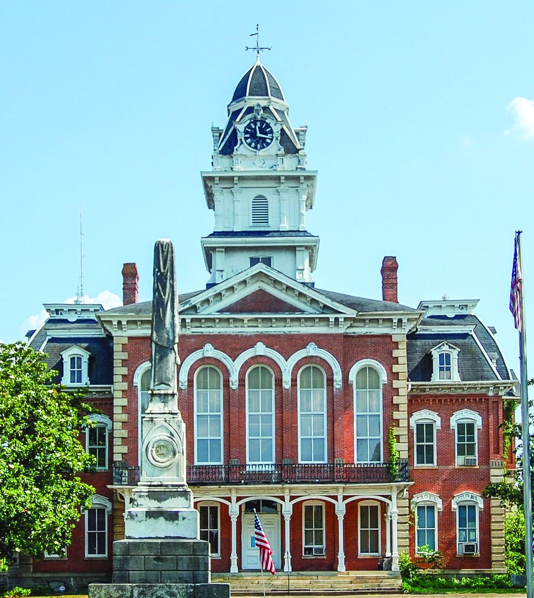 Hancock County, Sparta. This modest obelisk, erected by the Ladies Memorial Association, predates the Hancock County Courthouse by two years. The Second Empire structure, built in 1883, was destroyed by fire in 2014. Reconstruction is underway.