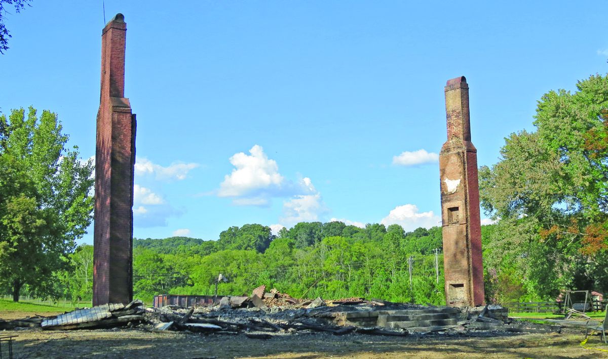 Historic Joseph Wilson House burns to the ground only leaving the two brick chimneys.