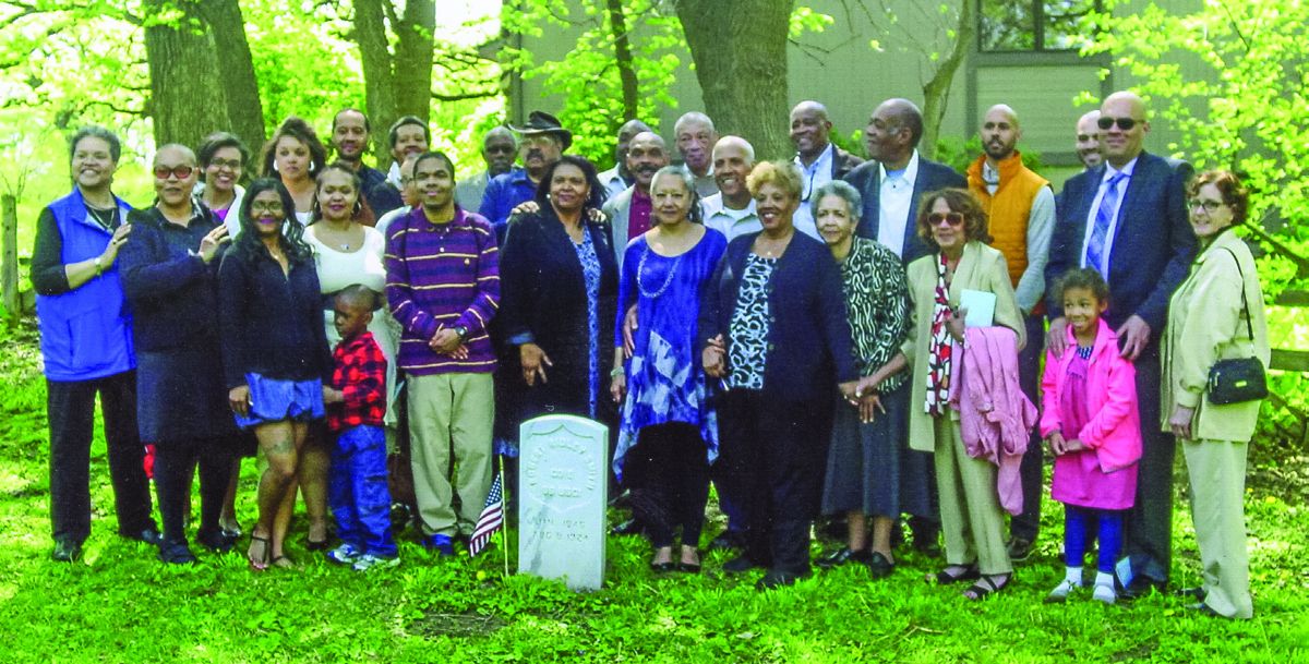 Descendants of Robert R. Smith at his new grave marker.