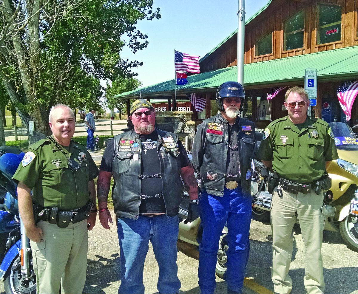 L to R: Montana Highway Patrol Sgt. Scott Ayers, Patriot Guard Eastern Assistant State Captain Bob Newman, Patriot Guard Member Wes, Lambert, Montana Highway Patrol Trooper Eric Winburn.