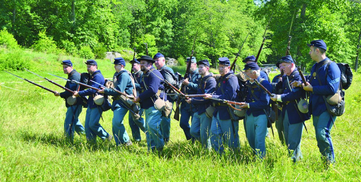 Members of the 13th New Jersey charge the spectators