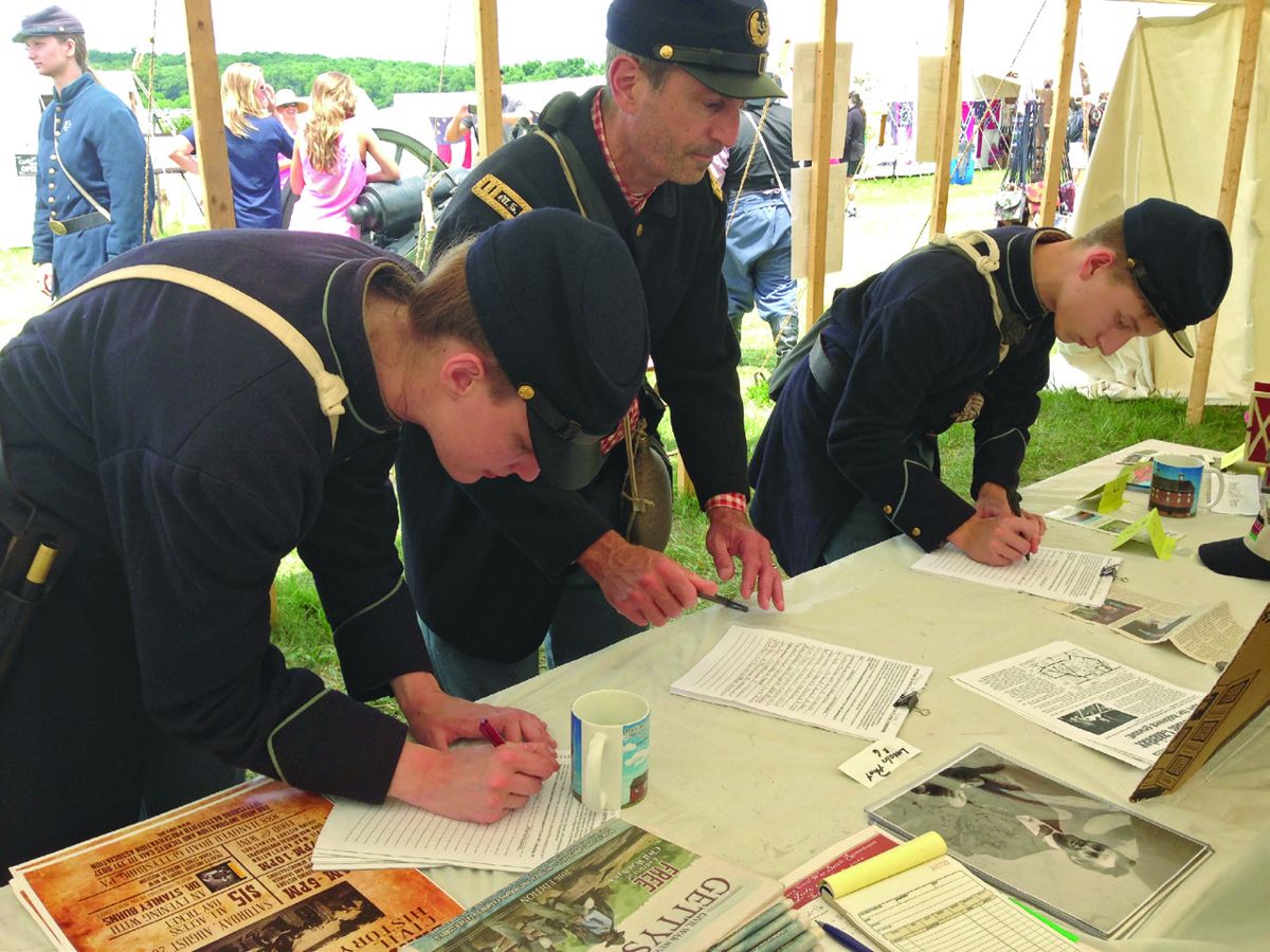 New recruits are lined up for inspection outside the children’s activities tent at the reenactment.
