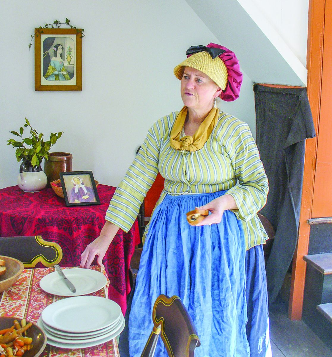 Melinda Day, Lead Park Ranger, of Harpers Ferry, W.V., brings the Roeder Family Parlor to life as it may have looked during a Washington’s Birthday celebration by wearing colonial garb.