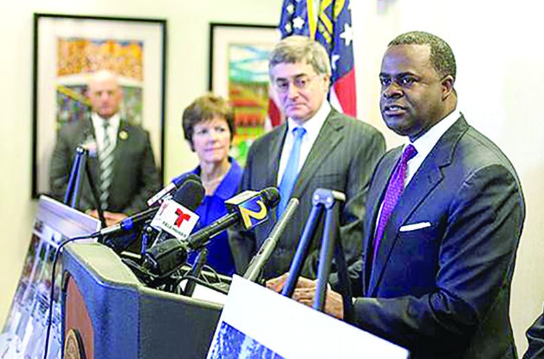 July 23, 2014: (Right to left) Atlanta Mayor Kasim Reed, Atlanta History Center President and Chief Executive Officer Sheffield Hale, and Atlanta City Councilwoman Mary Norwood announce the move of the Atlanta Cyclorama.