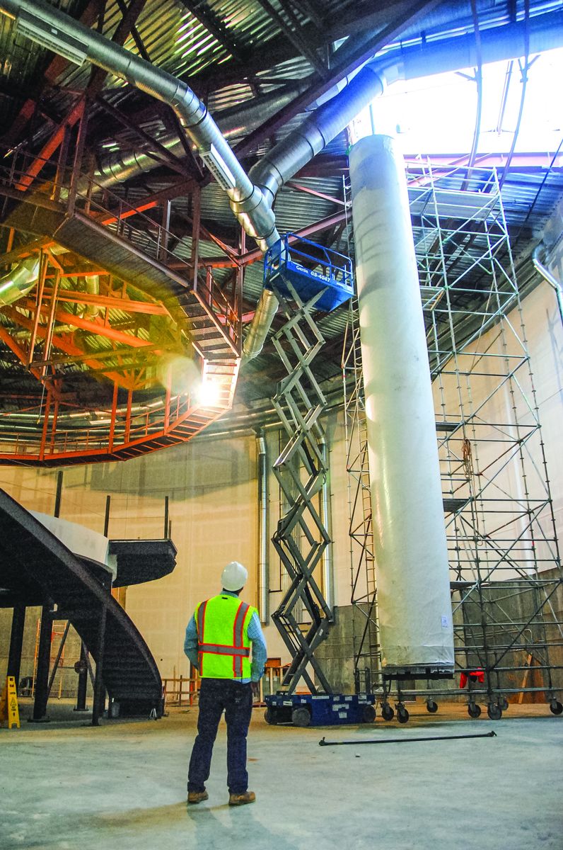 February 10, 2017: Conservators separated the painting into two sections and rolled it onto two custom-built 45-foot-tall steel scrolls. Here Scroll 1 is lowered through the roof of the new Lloyd and Mary Ann Whitaker Cyclorama building.