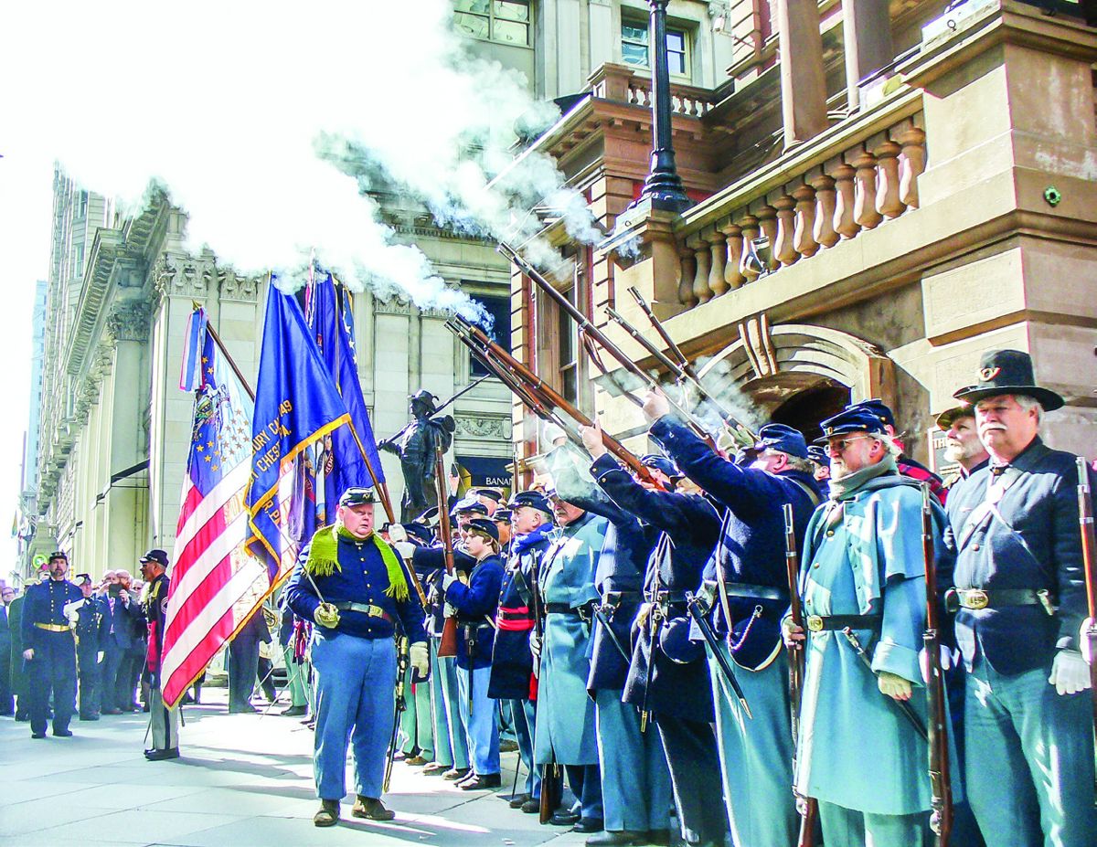 Union reenactors fire a salute to President Lincoln.
