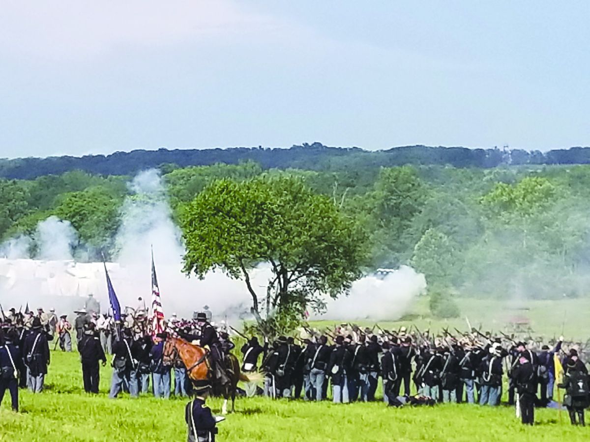 Confederate guns fire into the center of the Federal line (Photos provided by the Gettysburg Anniversary Committee)