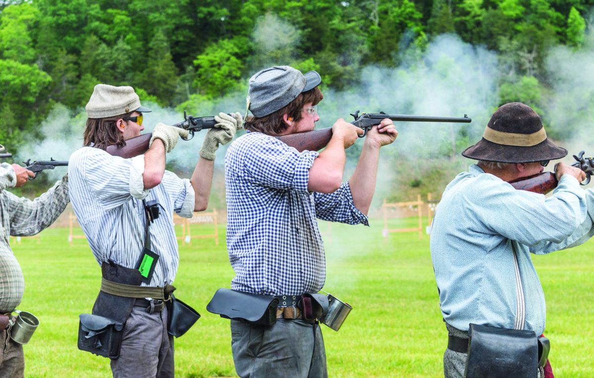Brothers Luke (with a Smith) and Taylor Leapley (with a Maynard) of the 13th Confederate Infantry blaze away during the Carbine Company Match.
