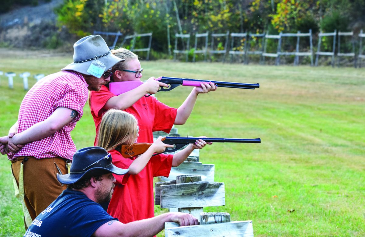 These young BB gun shooters from Company D, 33rd Virginia Infantry, “Little Mountain Rangers,” receive close instruction on their marksmanship from their coaches.