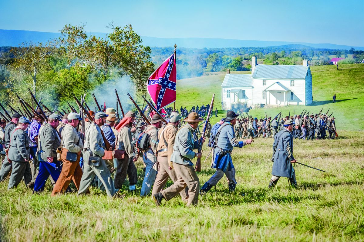 Confederate Infantry marching by the Heater house.
