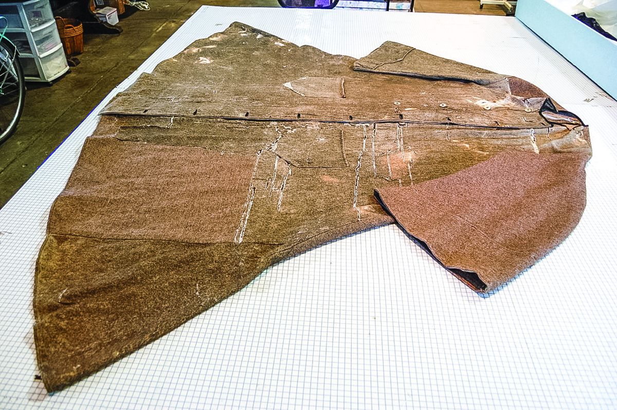 Coat front, before conservation.