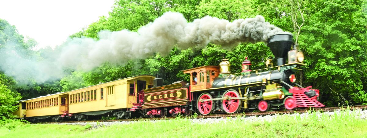 The York – William H. Simpson – steams along the Railroad Heritage Trail with black smoking pouring from its stack.