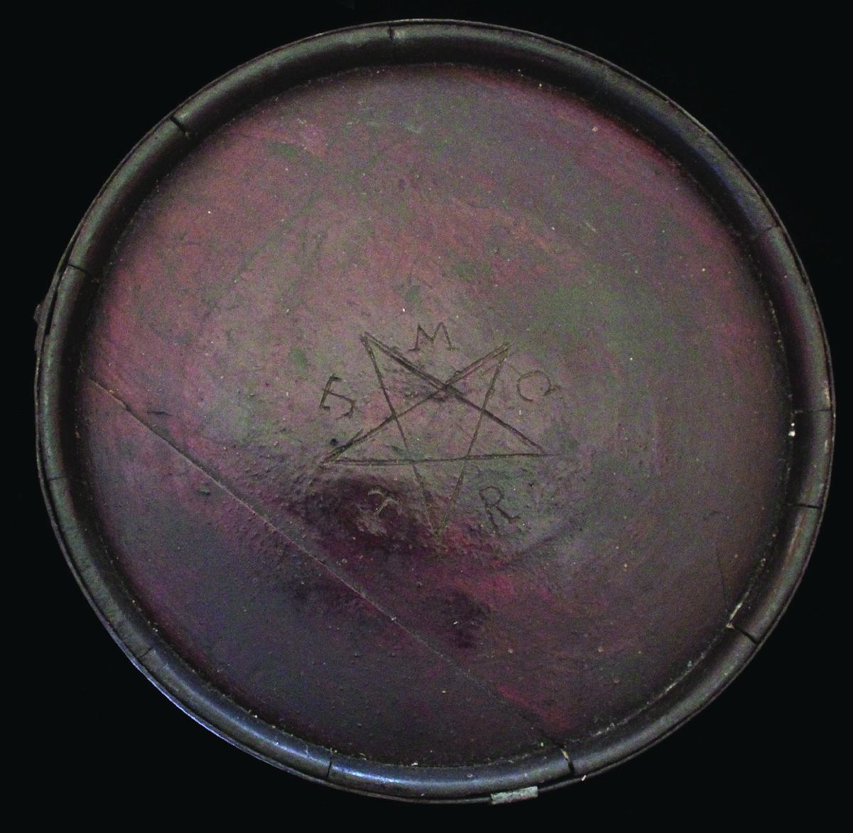 The full face of the Terry’s Texas Ranger’s Canteen showing the central star and initials.