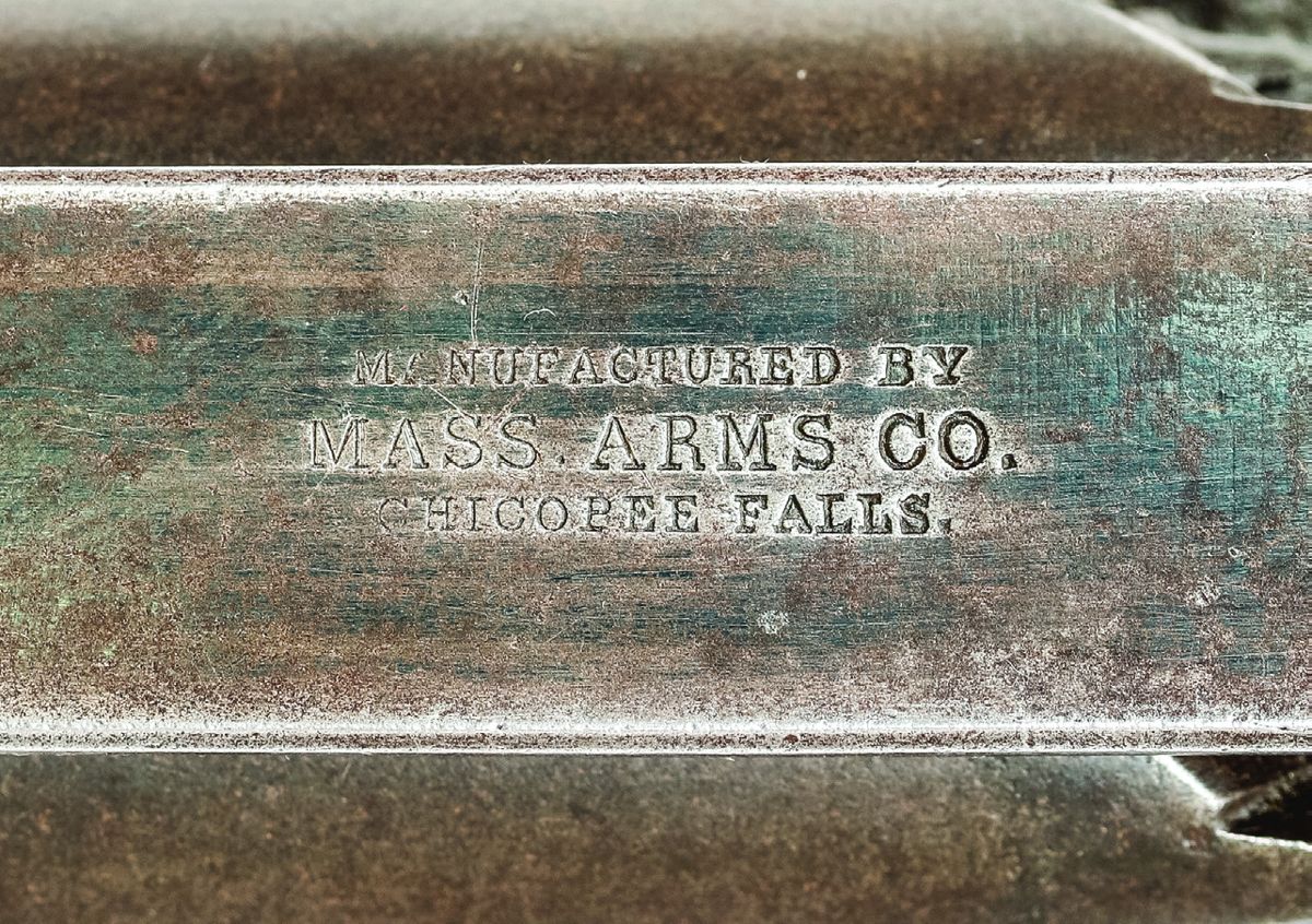 Topstrap marking of Mass. Arms Adams #554.
