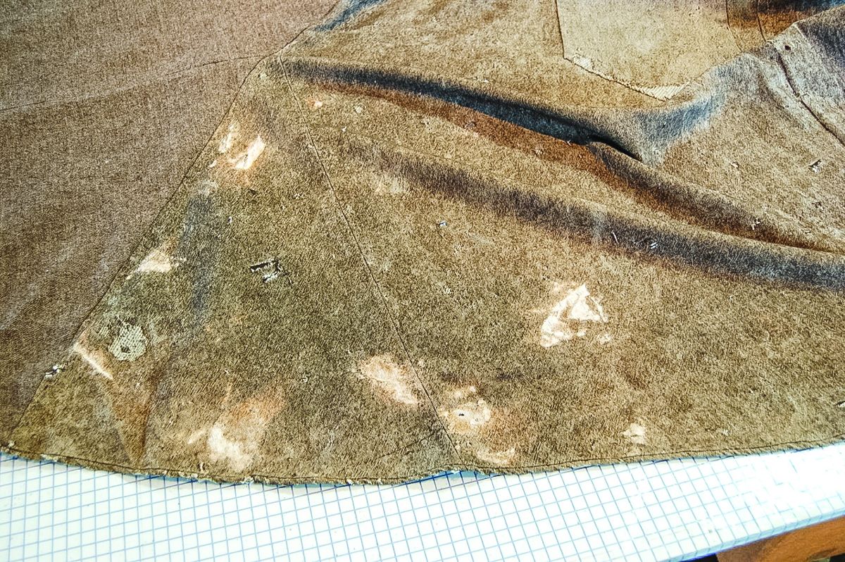 Bleached out areas at bottom of coat.