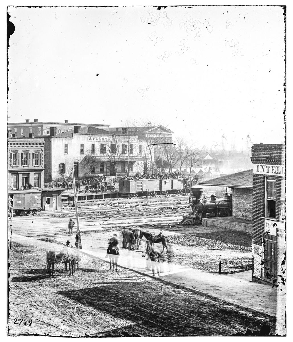 Above photographs of the Intelligencer’s Office, Atlanta’s daily newspaper, at the foot of Whitehall Street. Top is LOC 03359a; bottom is 02216a. (All photos by Barnard, Library of Congress)