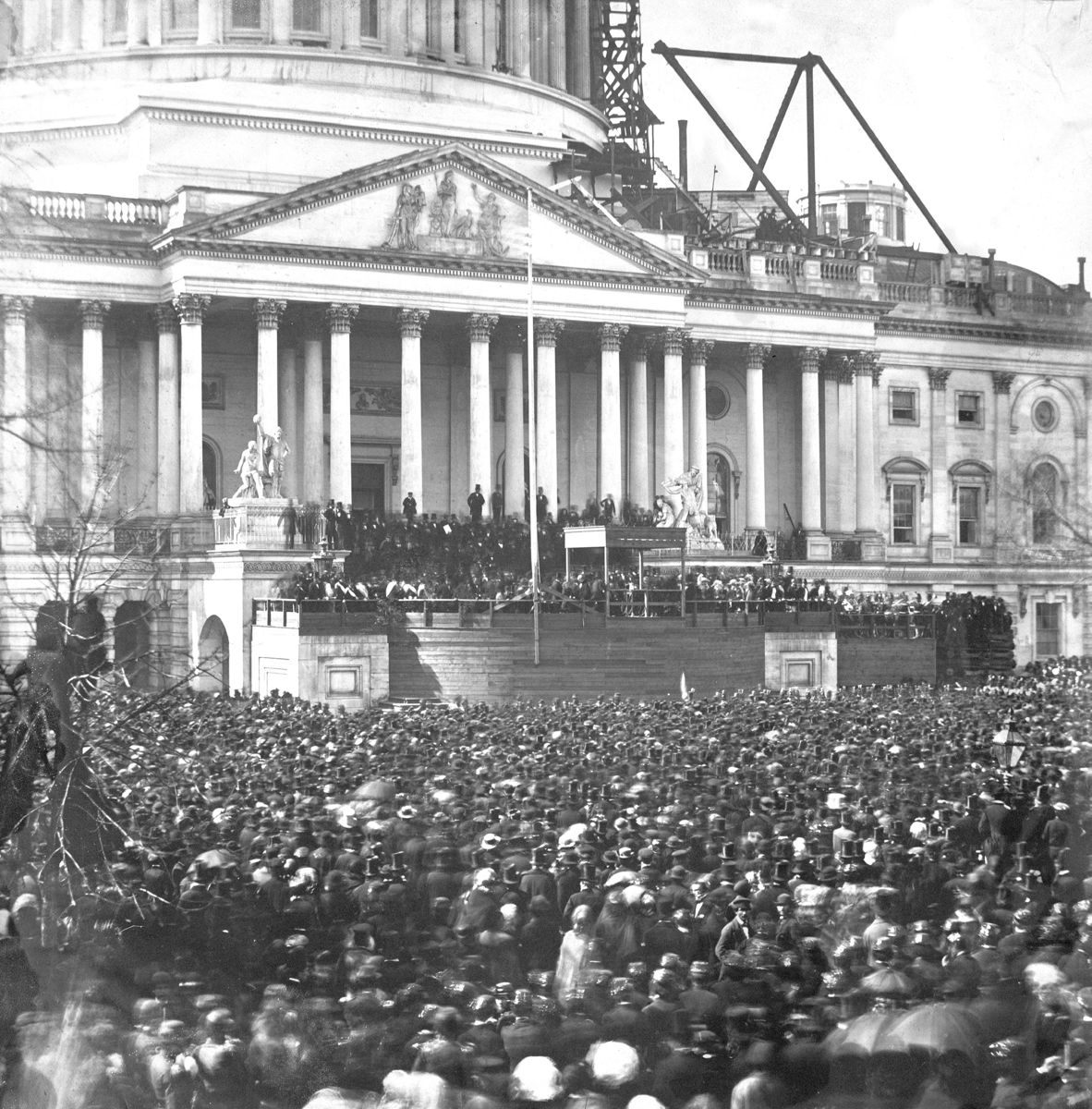 Inauguration of Mr. Lincoln, March 4, 1861. Lincoln is standing under the wood canopy, at the front, midway between the left and center posts.