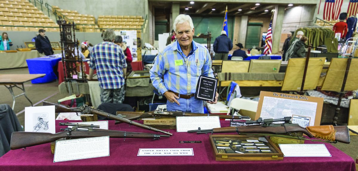 Brian Riel with his Sniper Rifles from the Civil War through World War ll including a rare Whitworth rifle.