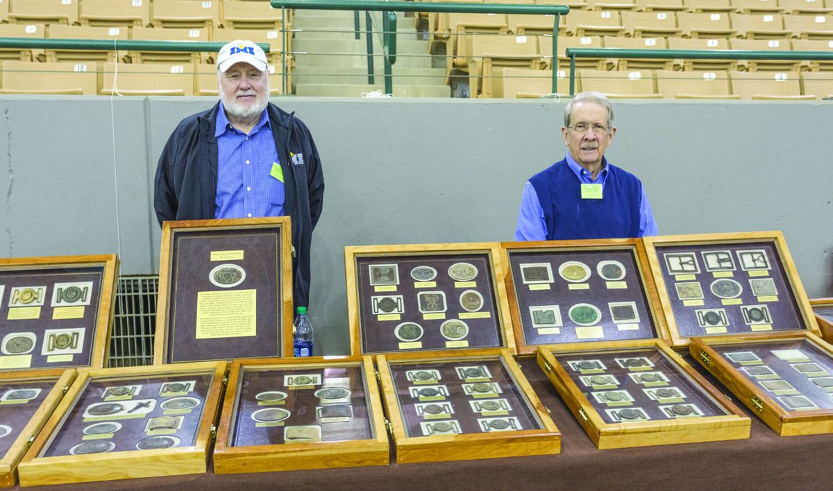 Don Phillips and Bill Blackman with their award winning display of Confederate buckles and plates.