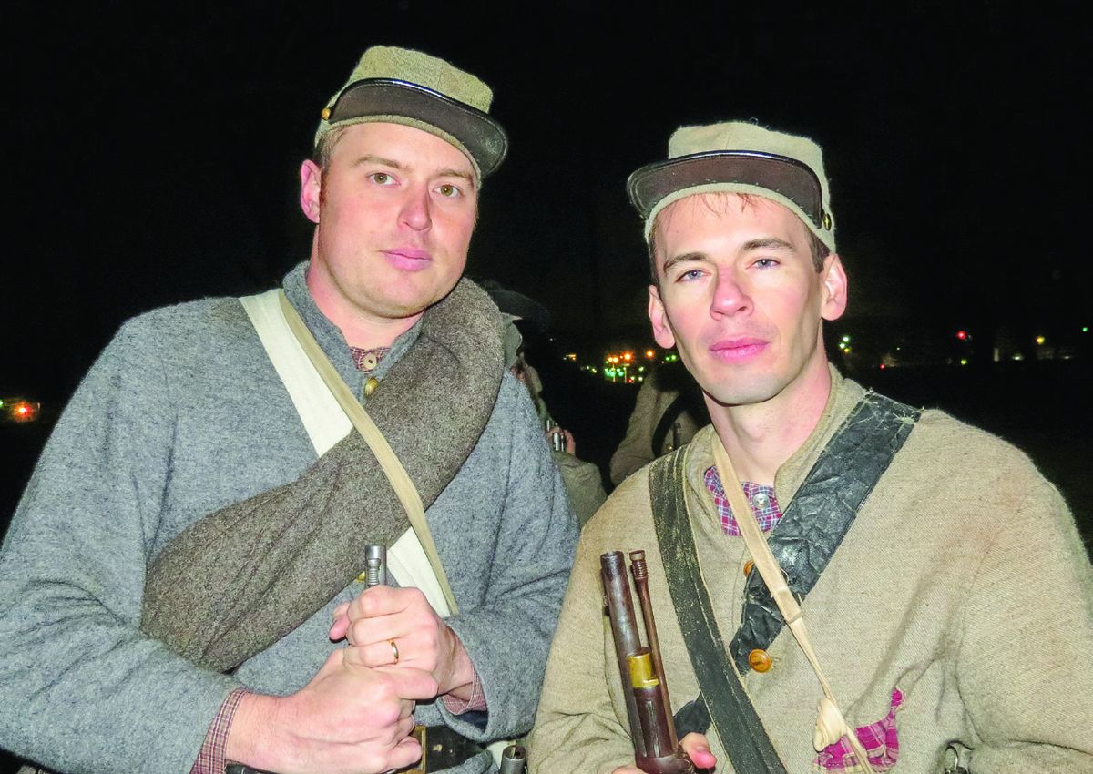 Part of a group of reenactors who marched the length of the battlefield 152 years after the actual attack. Mike Hoover, left of Franklin. Michael Johnson, right of Christiana, Tennessee.