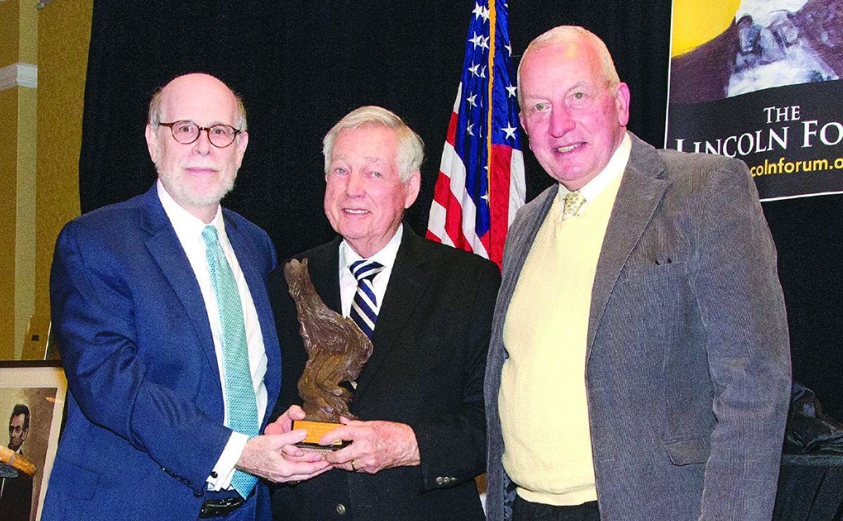 Lincoln Forum Vice Chairman Harold Holzer (L) and Chairman Frankl J. Williams present annual Richer Nelson Current Award of Achievement to Professor James I. “Bud” Robertson, Jr.
