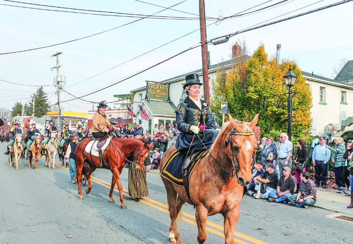 Holly Ray and the Civilians on horseback.