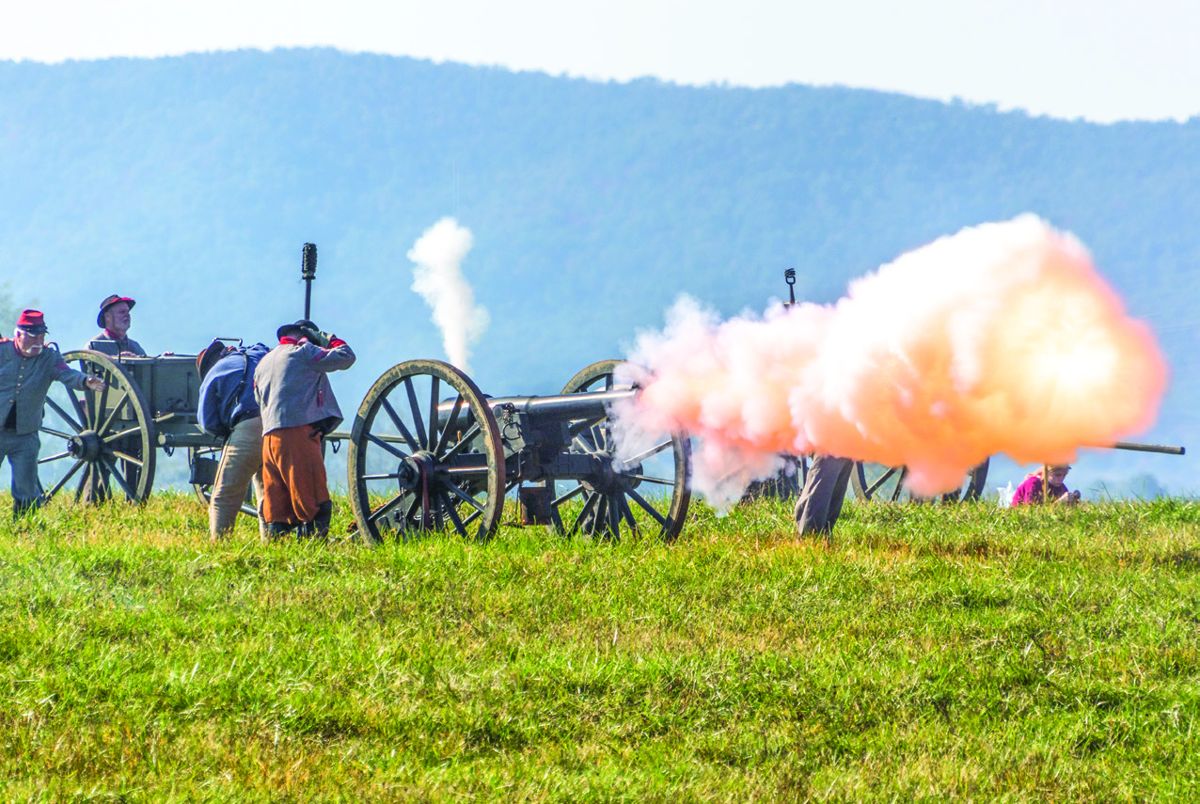 Cannon fire erupts during the battle to repel the enemy.