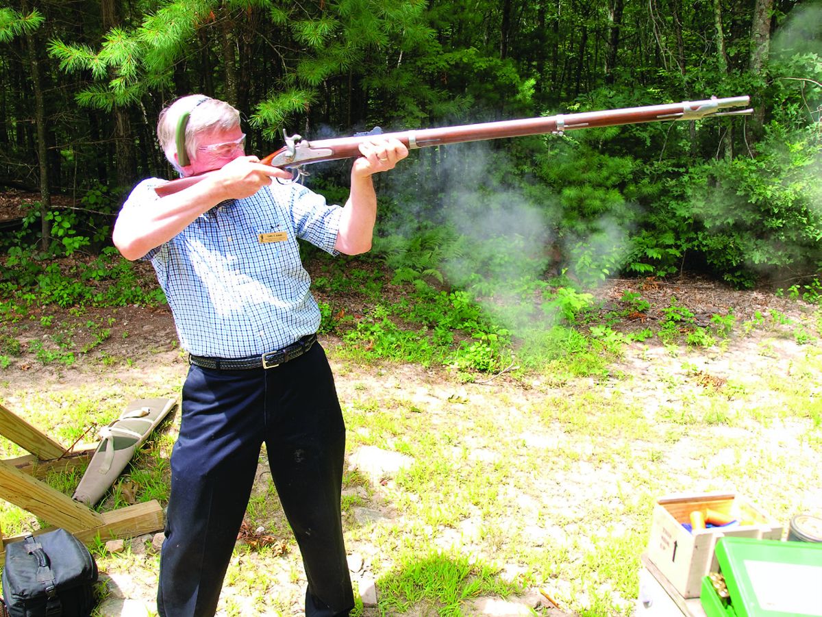Carl Earn takes aim and fires at a target during the shoot.