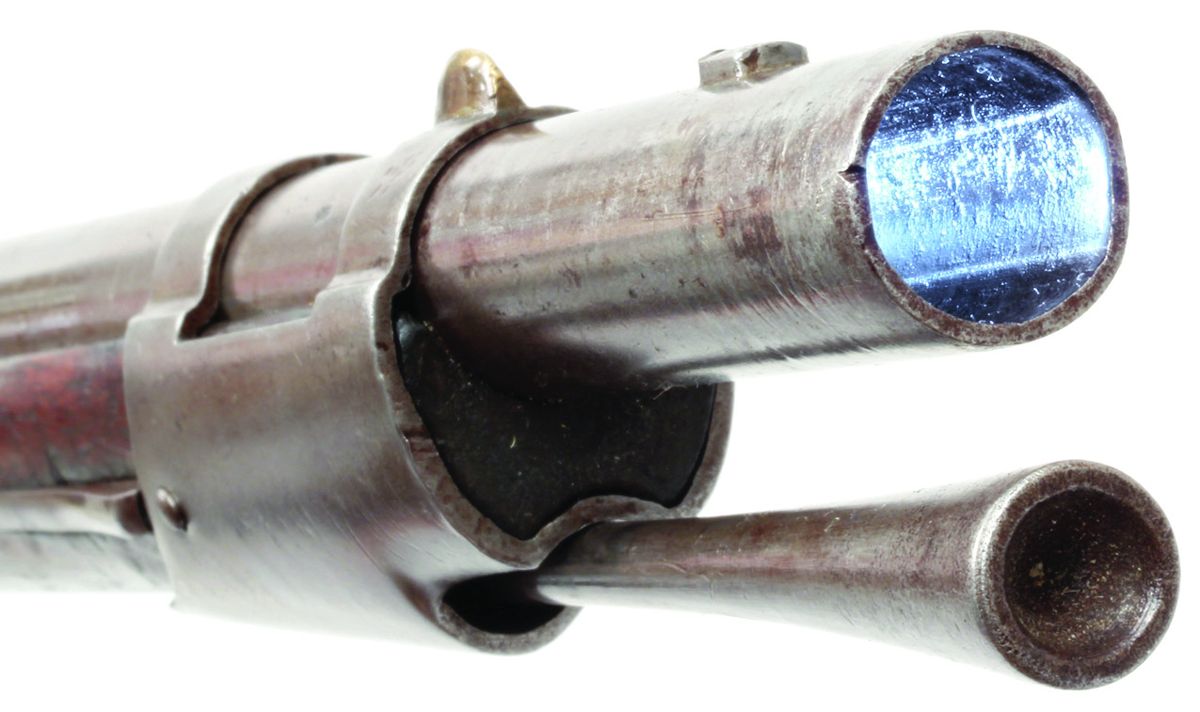 Detail view of the Greenwood rifling in the bore of a state of Ohio altered U.S. M-1816 Type III contract musket. Note also the modified trumpet shaped ramrod with cupped head for elongated ball (Minié) ammunition. The standard U.S. M-1816 ramrod had a button head and was designed for use with round ball ammunition.