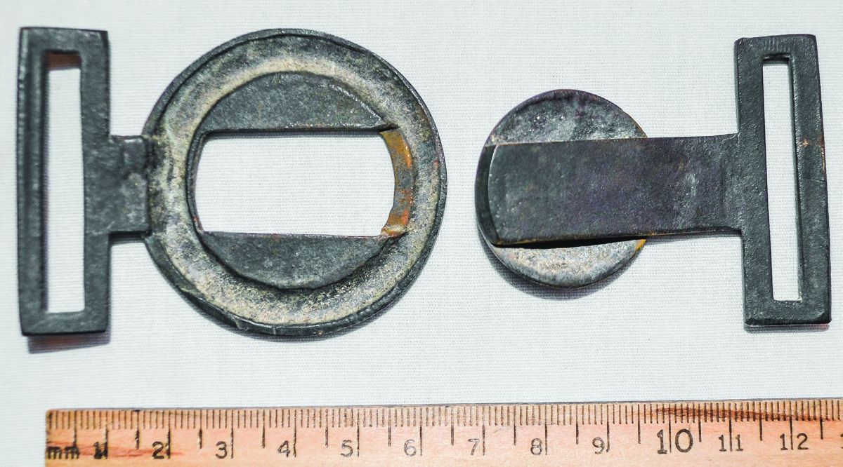 Disassembled view of the back of the two-piece belt buckle.