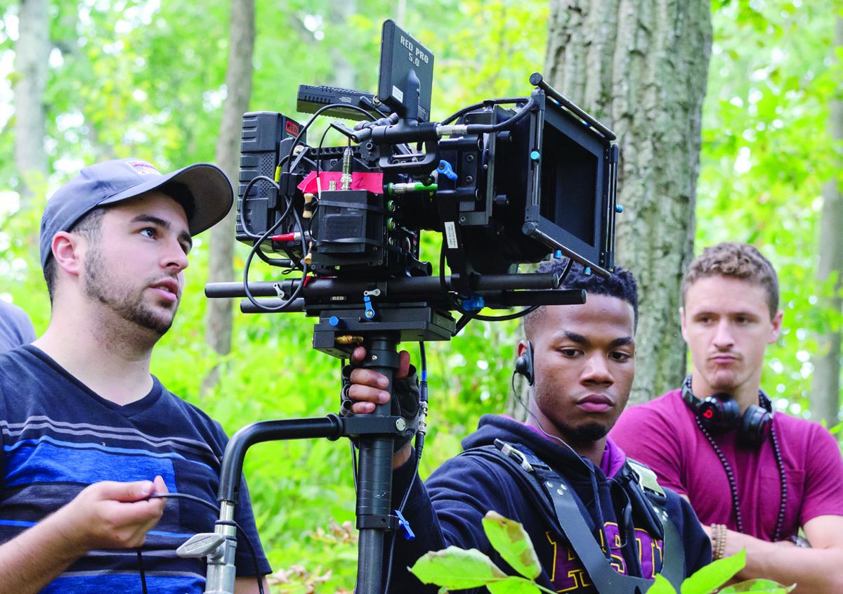 Josh Saideman, Jake O’Connor Hart, and Ryan Monolopolus (director) film a scene.