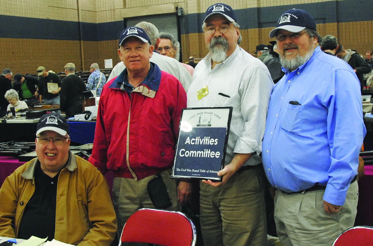 Members of the Civil War Roundtable of Atlanta at their membership table. (l to r): Leon McElveen, Emmett Hall, Gordon Jones, Brian Wills.